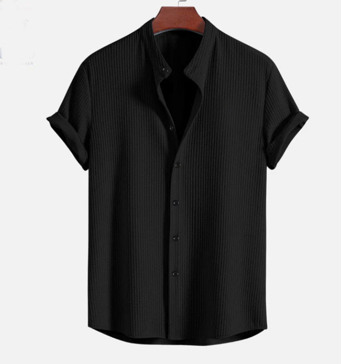 Black short sleeve button-up shirt with pointed collar and vertical textured fabric