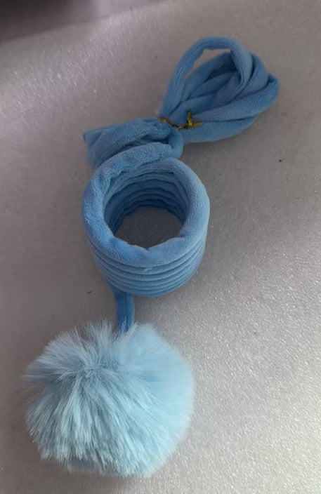 Cat spring toy wand with blue coil and light-blue fluffy pom ball