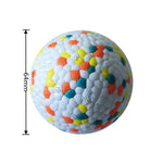 Textured dog chew ball full view with multicolor blocks on white