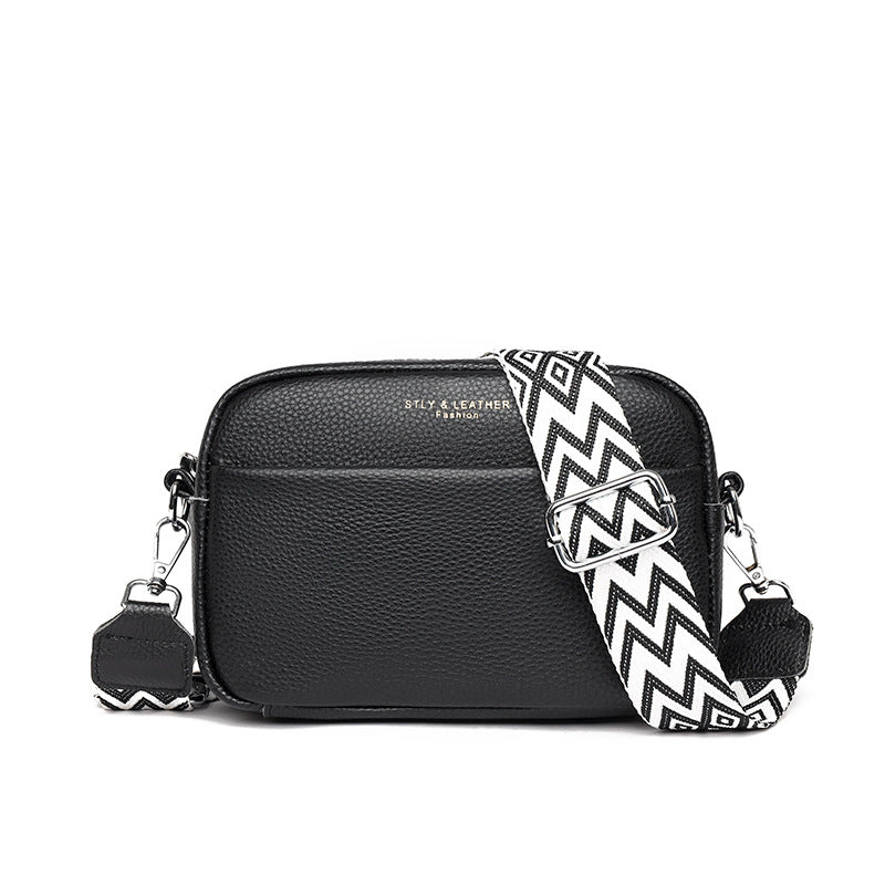 Black small square leather crossbody bag with zip top and wide rhombus embroidered strap