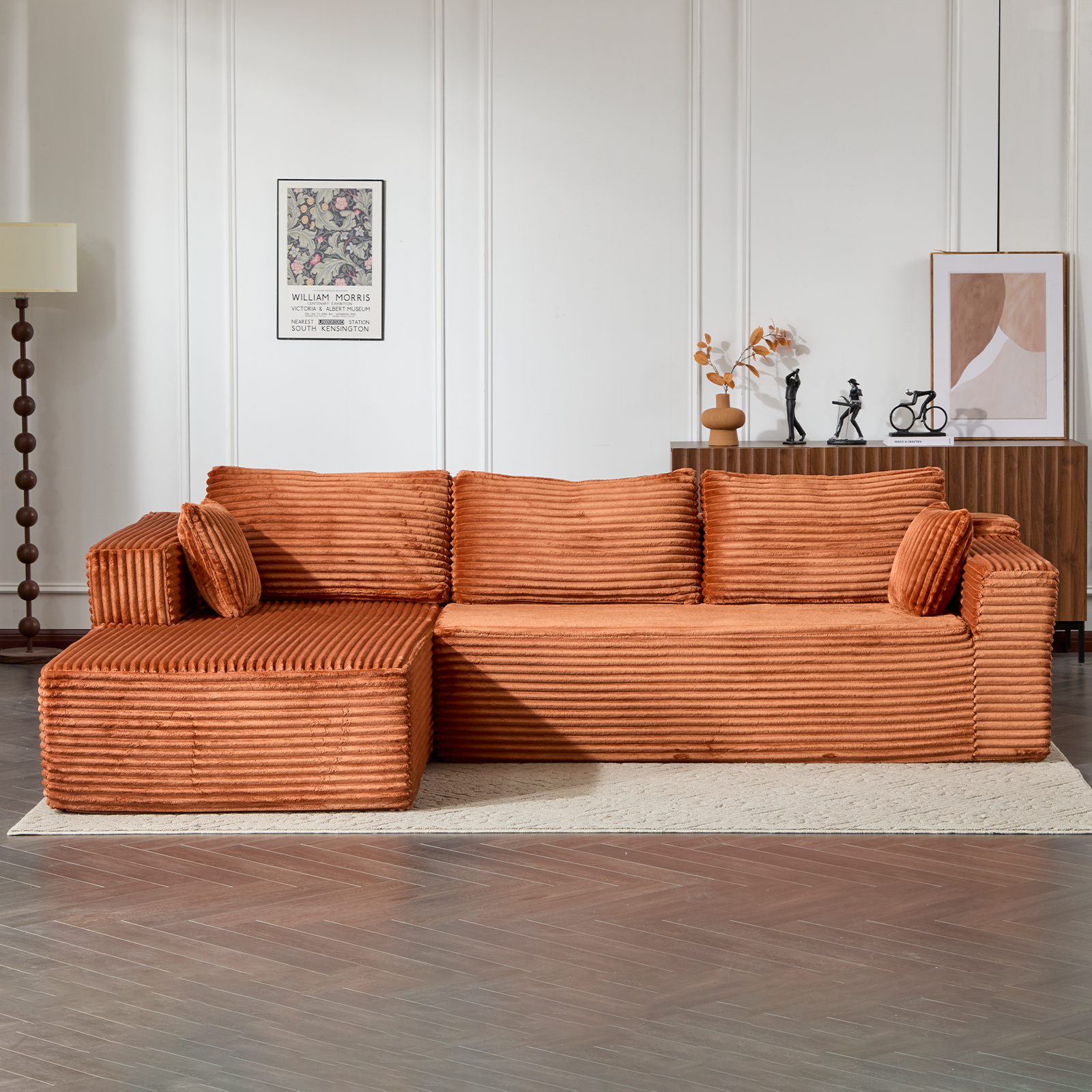 L-shaped sectional couch with chaise in brown corduroy, three seat cushions