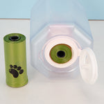 Dog waste bag dispenser accessory with rolled green plastic bags and opening