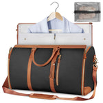 Foldable dark waterproof duffel bag with tan trim, open interior, shoulder strap