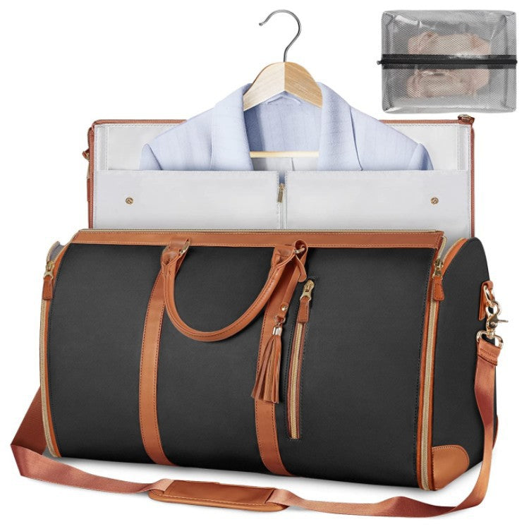 Foldable dark waterproof duffel bag with tan trim, open interior, shoulder strap