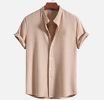 Light brown short sleeve button-up shirt with pointed collar and vertical textured fabric
