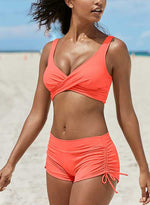 Red bandeau bikini set with crisscross bust and ruched high-cut tie-side cheeky shorts