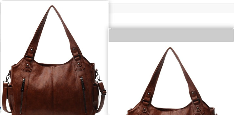 Brown PU handbag with top handles, shoulder strap, and front zip pockets