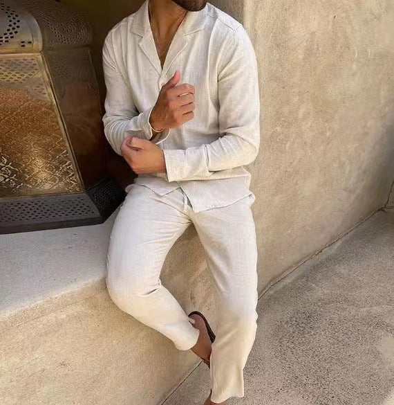 White long-sleeve lapel shirt and slim trousers set, standing pose with button front.