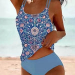 High-waist bikini swimsuit with blue paisley tank top and light blue solid bottoms