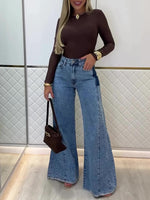 Light blue high-waisted flared jeans with front button and zip fly