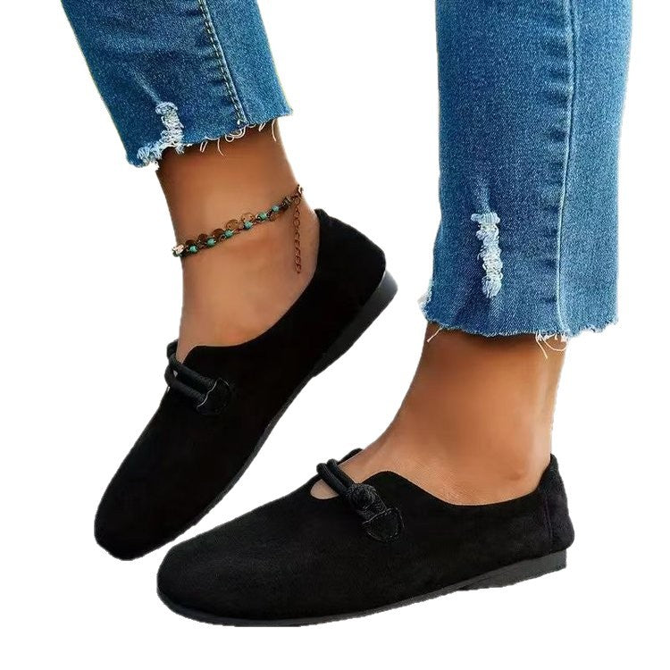 Black suede round-toe flat lace-up shoes with side bow and elastic detail