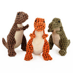 Set of plush dinosaur dog toys in brown, orange, and green with white belly panels