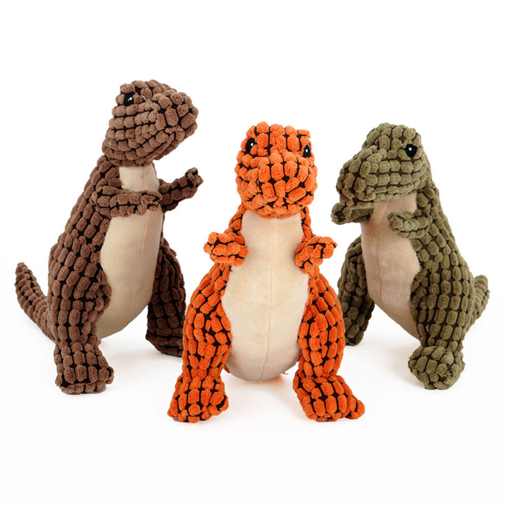 Set of plush dinosaur dog toys in brown, orange, and green with white belly panels
