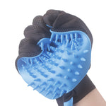 Blue silicone pet grooming glove with raised nubs and black fabric wrist strap