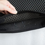 Double-layer cat litter mat, black textured surface with water droplets on top layer