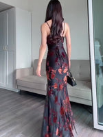 Black floral maxi dress back view with spaghetti straps and tied shoulder details