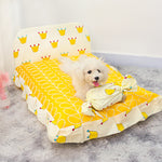 Small teddy dog pet bed, yellow crown and geometric print cover with plush bolsters