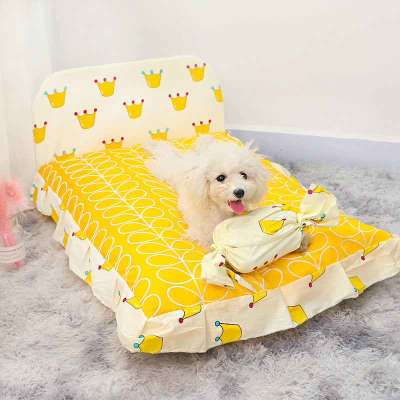 Small teddy dog pet bed, yellow crown and geometric print cover with plush bolsters