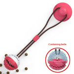 Red suction cup tug toy with spiky ball on brown cord, bells feature shown