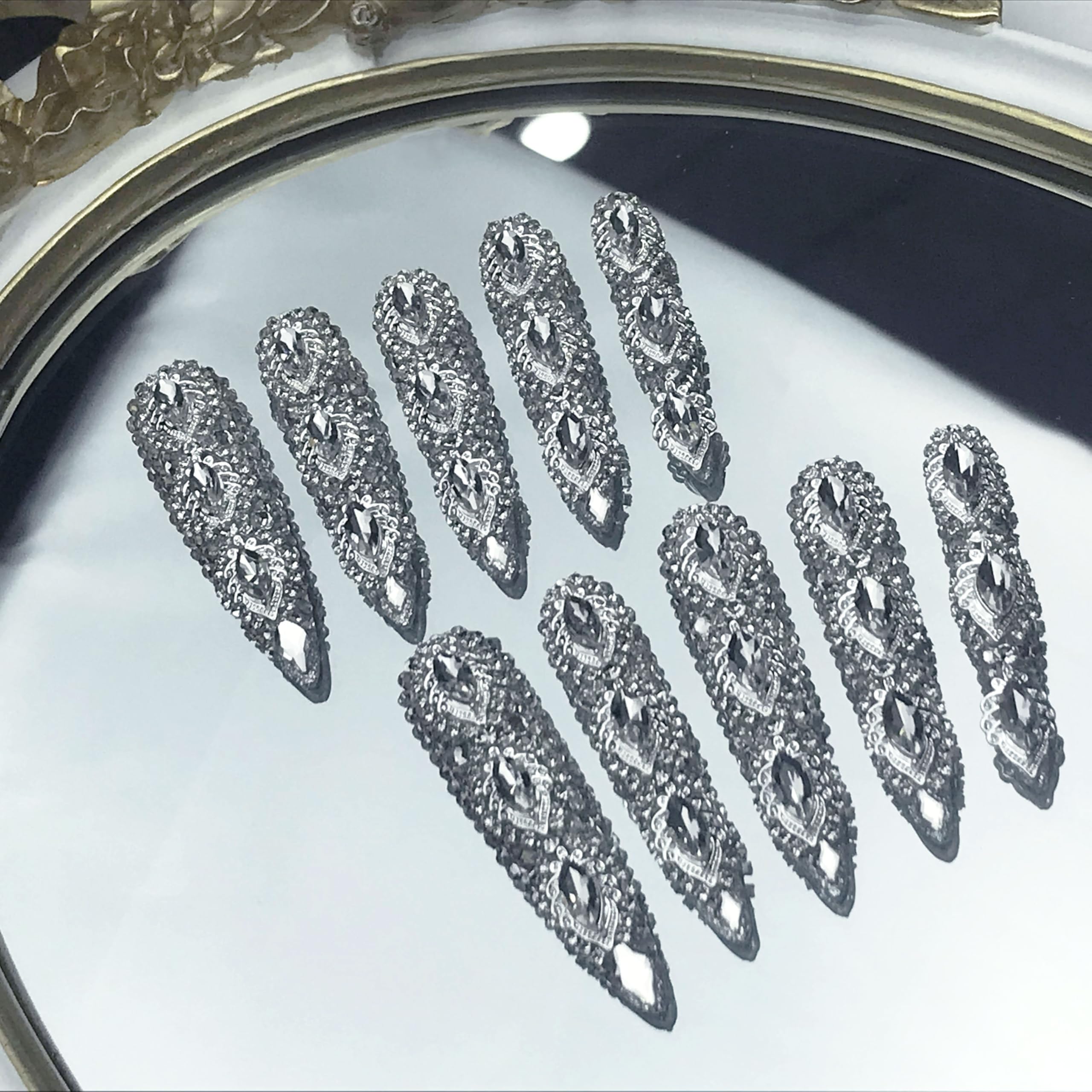 Long almond press-on nails, full silver rhinestone diamond 3D crystals with curved tips