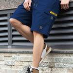 Men's navy utility shorts with drawstring, high waist, and flap cargo pockets