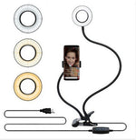 LED selfie ring light kit with three ring color options, clamp base, and USB cords