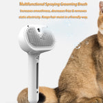 White pet comb brush with mist-spraying bristle pad, handheld grooming tool