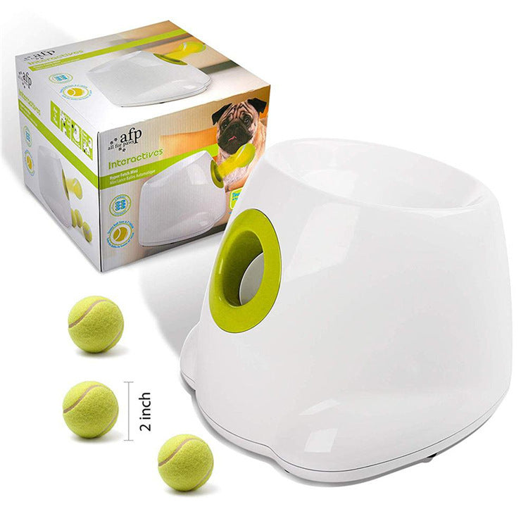 White ball launcher with lime-green ring and three yellow tennis balls