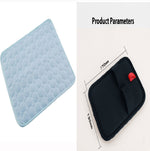 Pet cooling pad with bubble-textured quilt, light blue cover, dark border, red tag