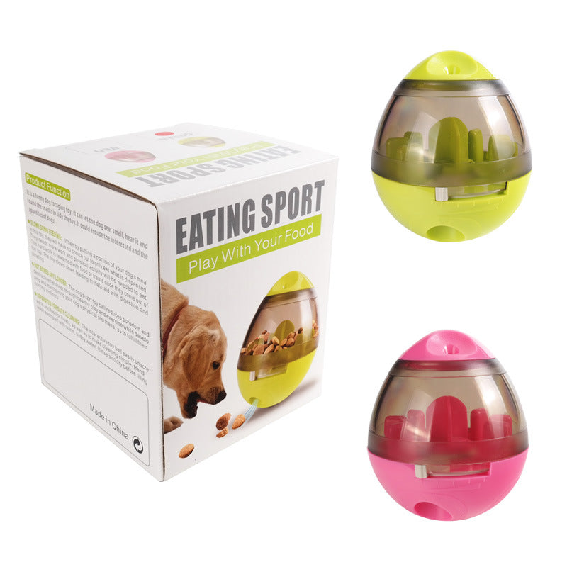 Pet food dispenser ball toy in green and pink with retail box