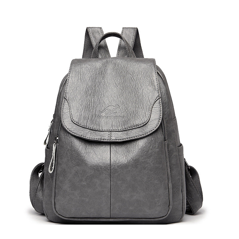 Women's PU leather travel backpack with front flap and side zippers, gray