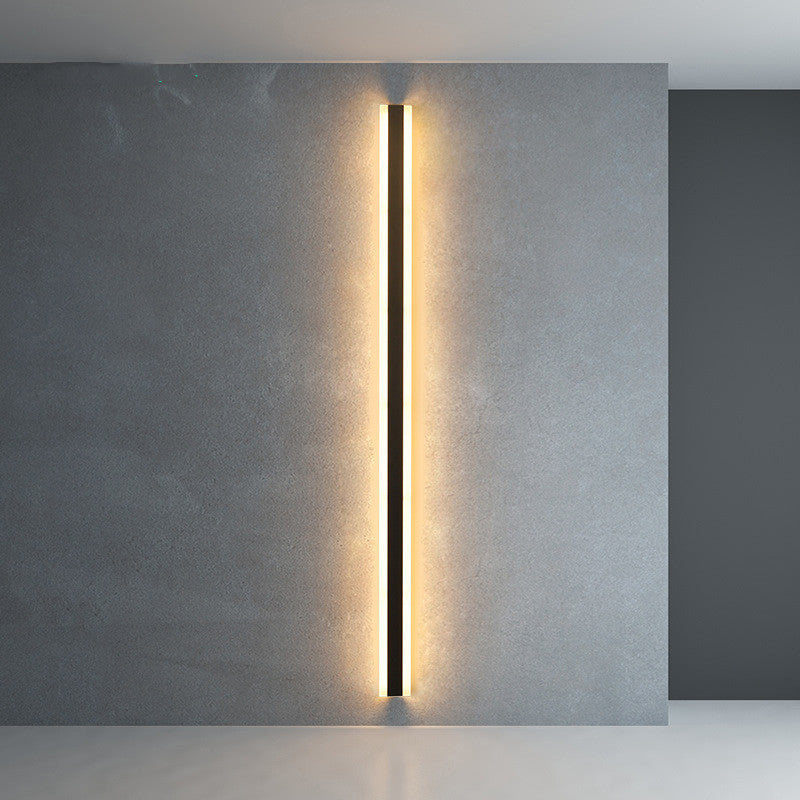 Minimalist LED wall lamp, long vertical acrylic light bar casting warm glow