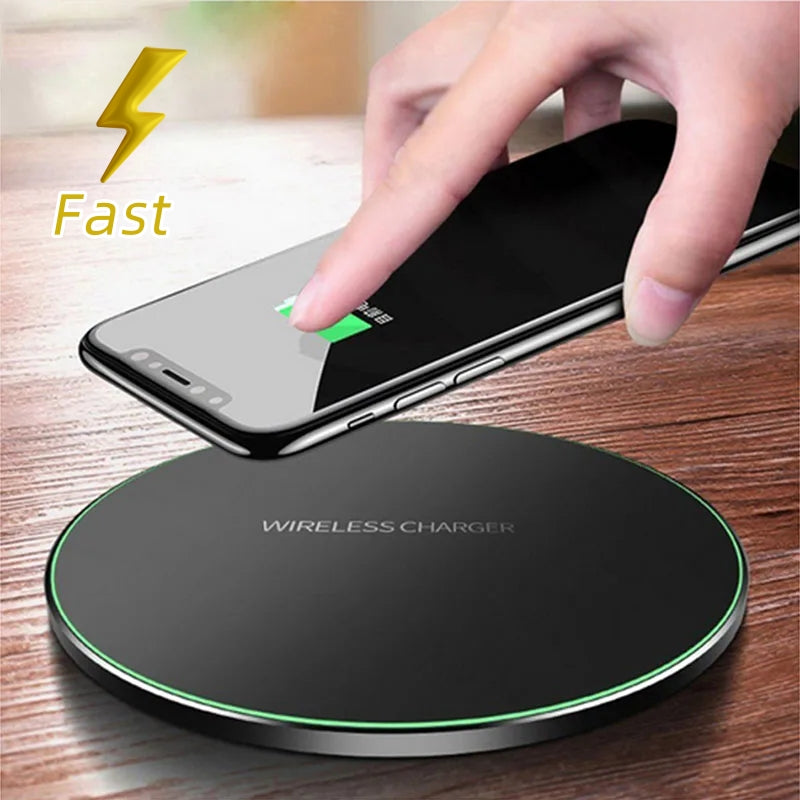 Black wireless charging pad with green LED ring, phone placed on top for charging
