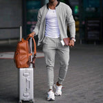 Men's zip-up long sleeve jacket and drawstring sweatpants set in light gray, tapered legs