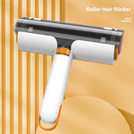 Pet hair removal roller with white handle and orange grip, dark transparent lint drum