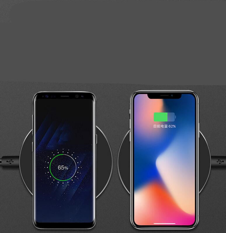 Wireless charging pad with two phones positioned above, charging indicators on screens