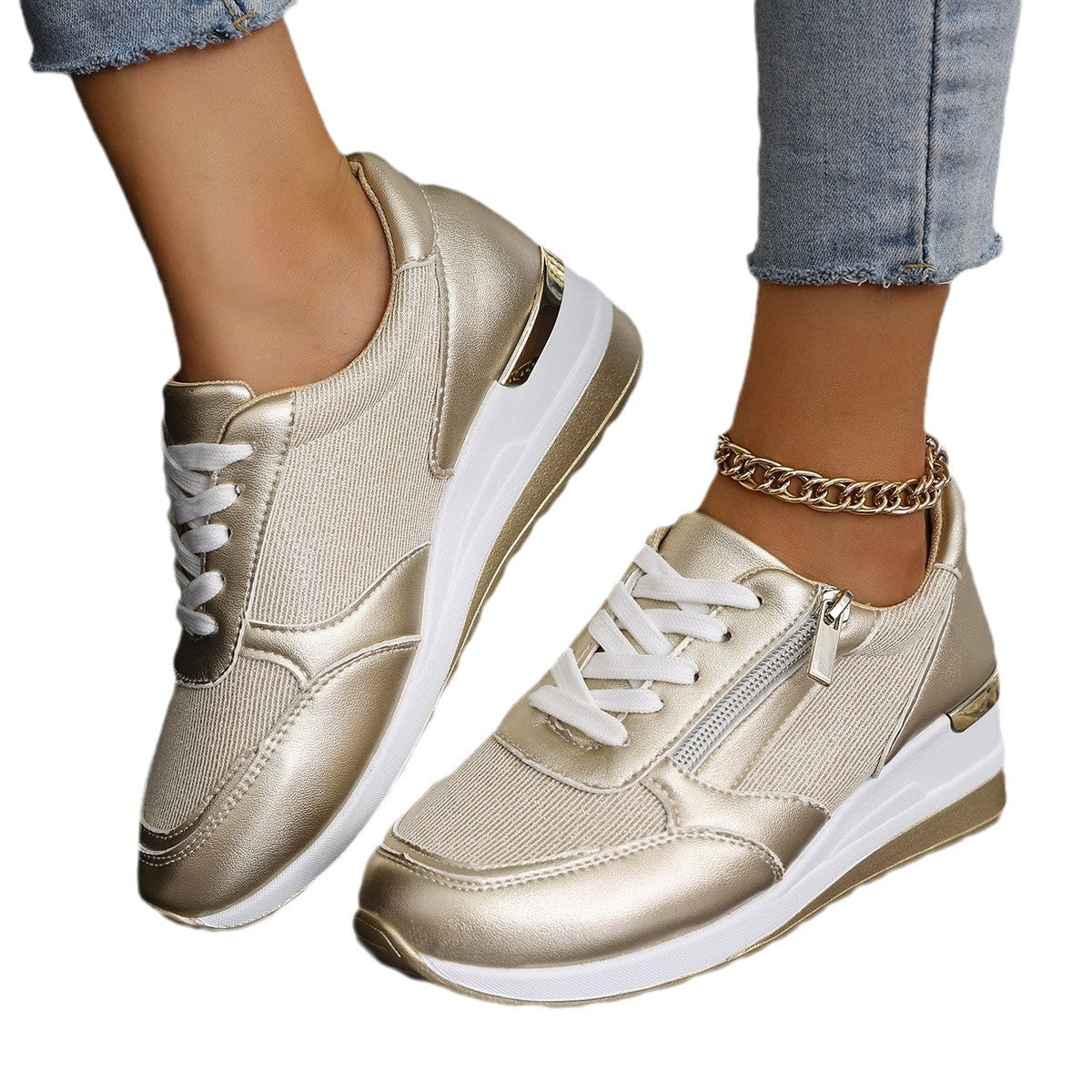 Women's gold lace-up sneakers with side zip, thick white sole and ankle chain detail
