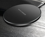 Black wireless charging pad with 'WIRELESS CHARGER' text, circular front view
