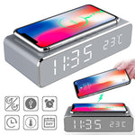 LED digital alarm clock with wireless charger, gray base, smartphone on top, time display