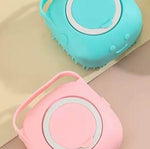 Pink silicone pet grooming massage glove brush with circular bristle pads and finger loop