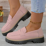 Pink round-toe flat loafers with buckle strap and black lug sole