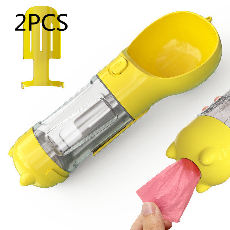 Pet water bottle feeder bowl with waste bag dispenser, yellow with pink waste bag.