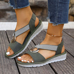 Olive-green woven-strap sandals with gold metal buckle, open toe and thick sole