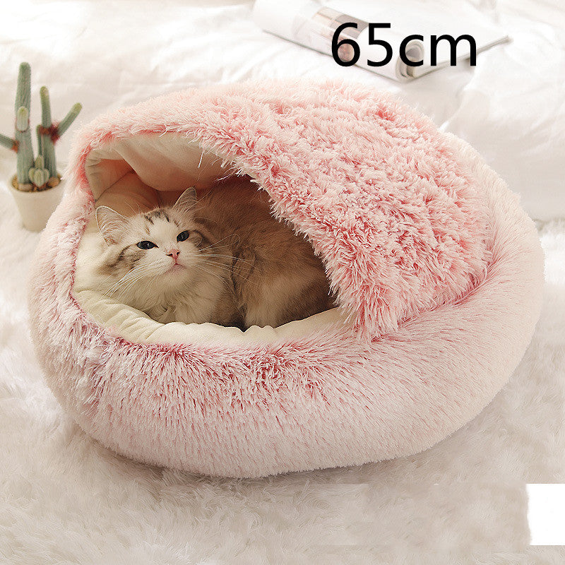 Round plush pet bed, pink 65cm, with a cat curled inside