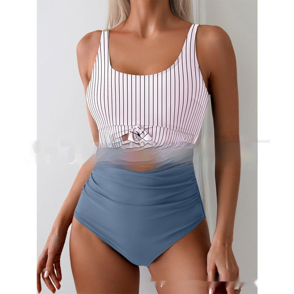 White striped one-piece swimsuit with tie-front waist and blue high-waist bottoms