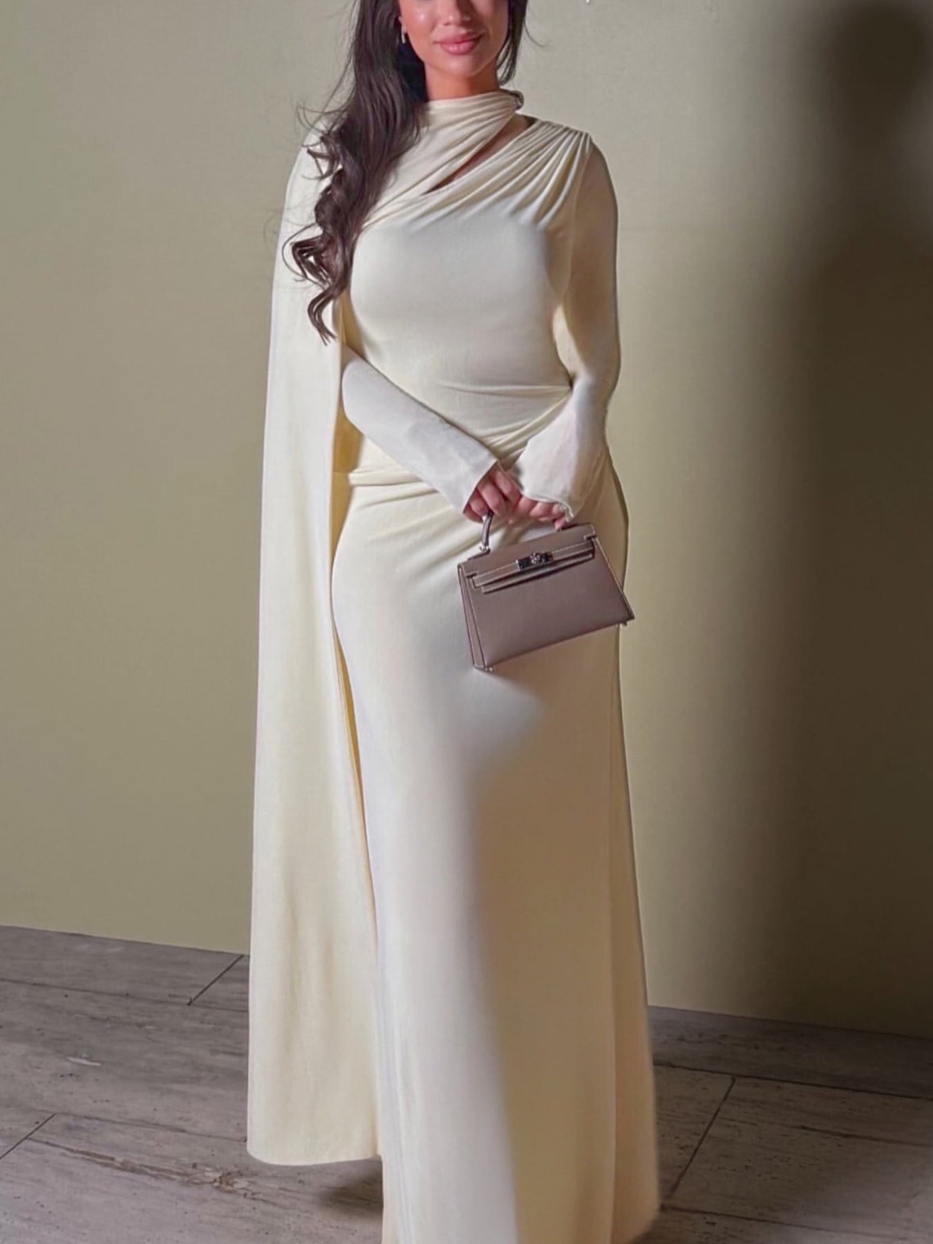 Ivory pleated maxi dress with long sleeves and draped neckline, front view