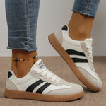 Women's casual sneakers in cream with black stripes, lace-up, gum outsole