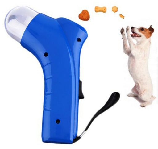 Blue treat launcher toy with clear front dome and black trigger switch, shown in action.