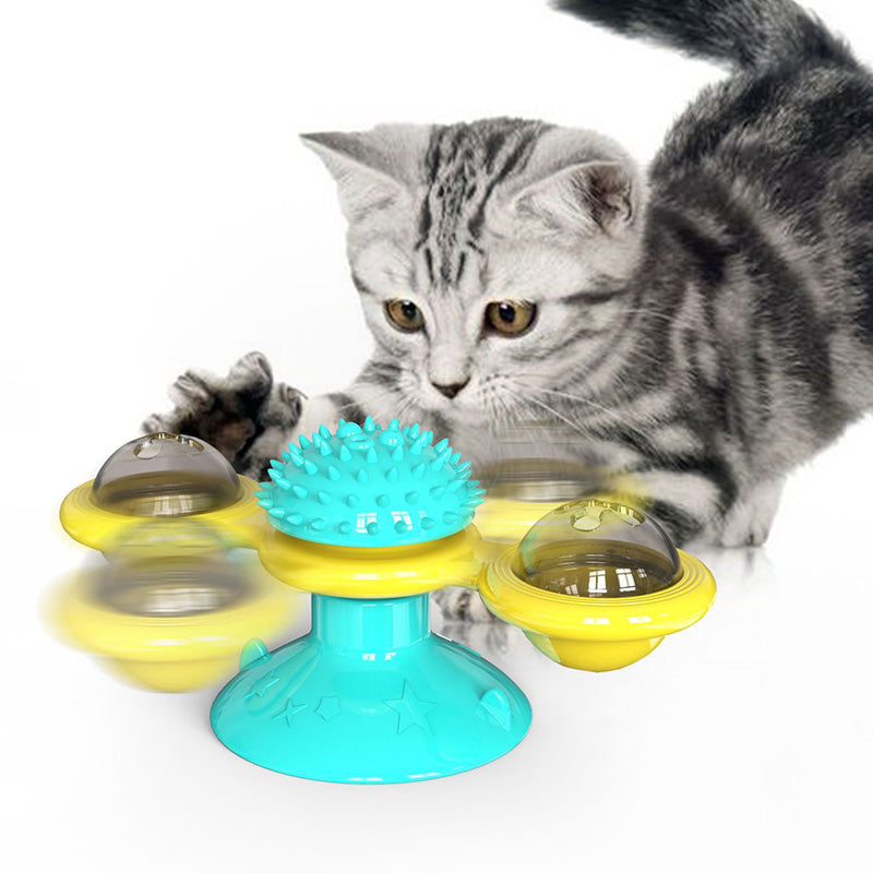 Cat rotating windmill toy with turquoise spiky top and yellow rotating discs
