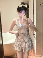 Cream polka-dot one-piece skirt swimsuit with ruched bust and tiered ruffle skirt